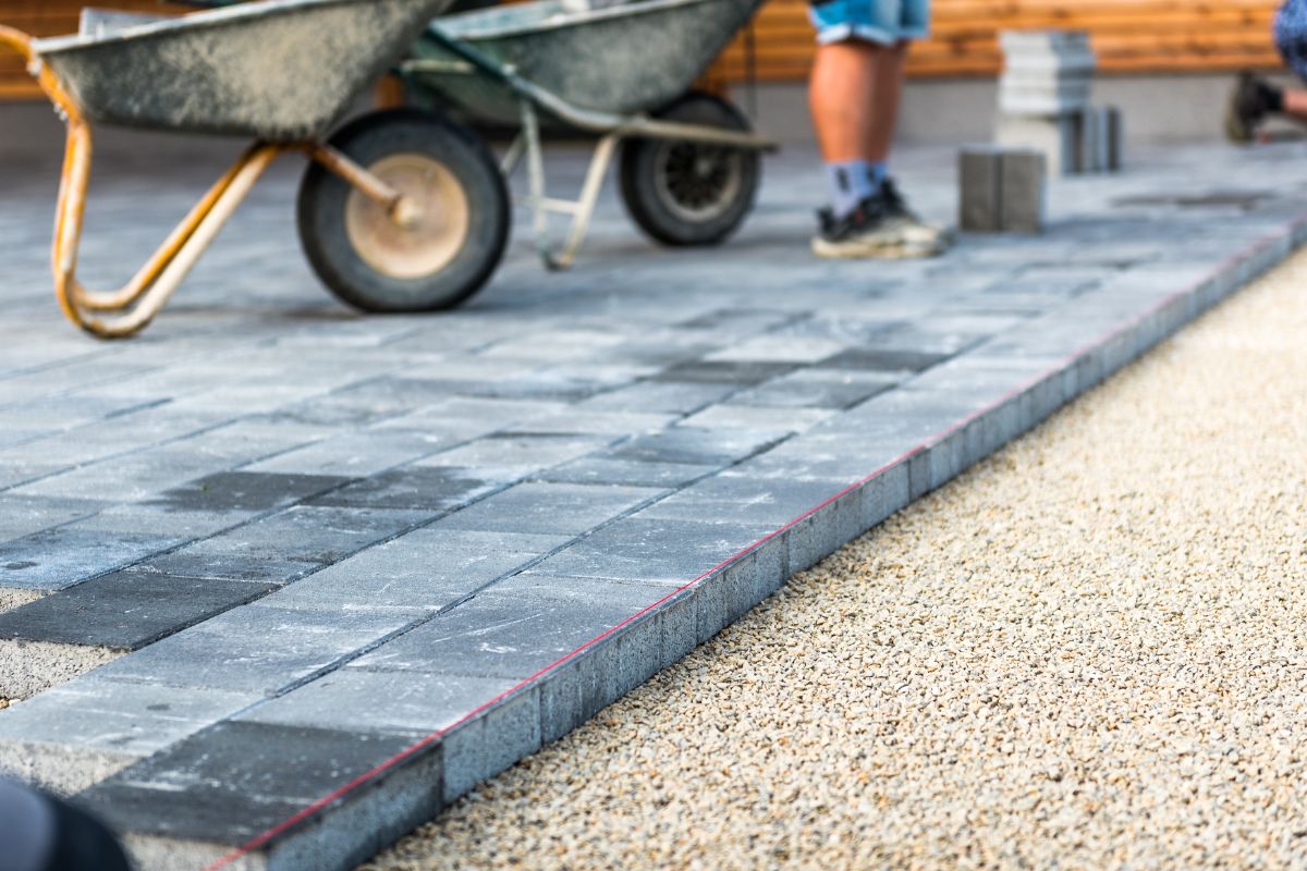 What are the steps to lay a resin driveway?